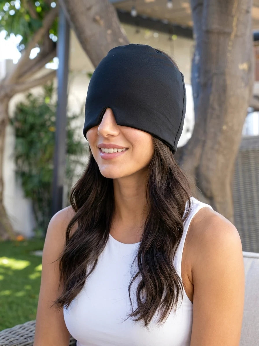 A woman wearing a black NuraCool cap outdoors