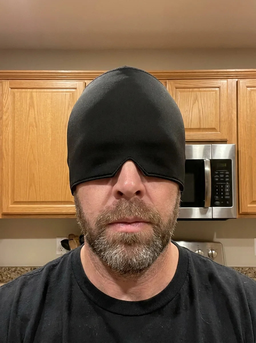 NuraCool customer wearing a black cooling cap over his eyes